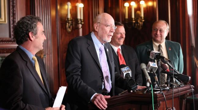 Senate President Fred Risser, D-Madison, announces the smoking ban compromise at the Capitol.