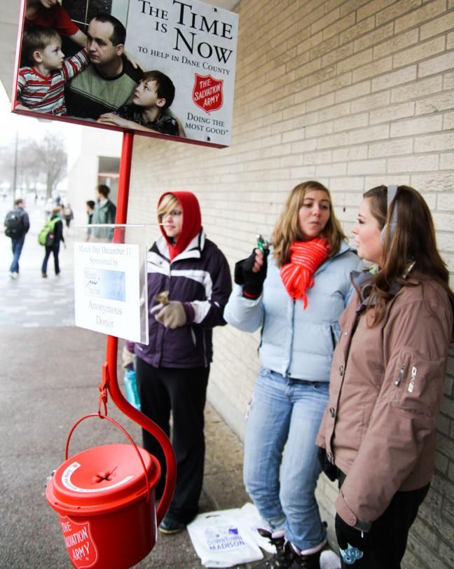 Volunteer bell-ringers with the Salvation Army stand outside Walgreens on State Street to raise money for local food pantries, mentoring programs and shelters.