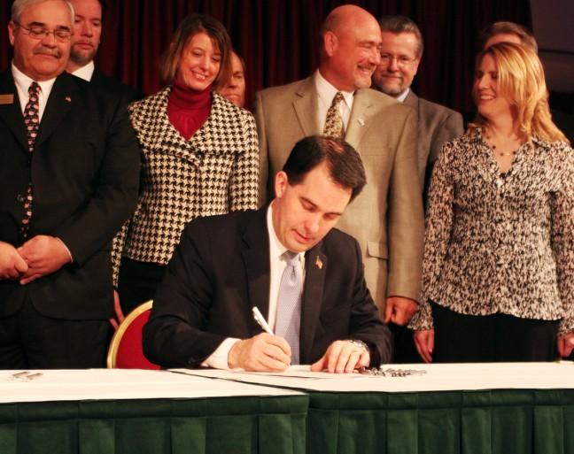 Gov.+Scott+Walker+signs+a+contentious+wetlands+bill+into+law+Wednesday+despite+months+of+controversy+surrounding+the+impact+the+bill+would+have+on+the+states+environment.