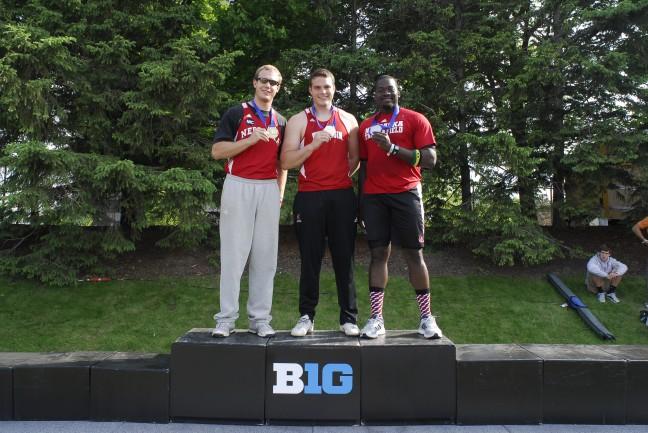 Danny Block stands atop the winners podium after placing first in the discus at the 2012 Big Ten Outdoor Track Championships.