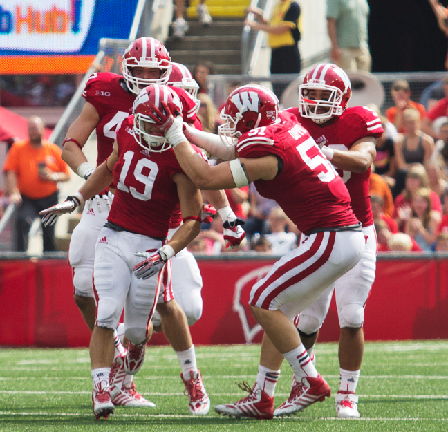 Safety Leo Musso is congratulated by teammates after an interception against Tennessee Tech. The badgers have focused  on forcing turnovers in 2013.