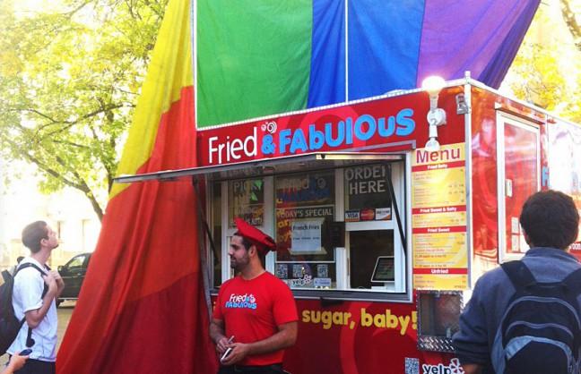 Fried and Fabulous owner Steven Lawrence flies a rainbow flag in direct reaction to recent anti-gay Library Mall protesters.