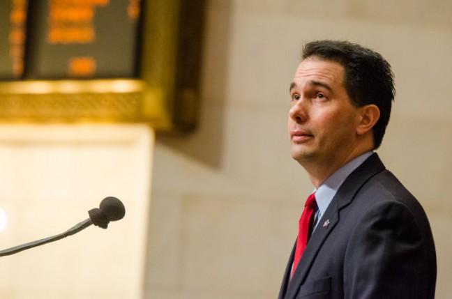 Walker, despite pushback, signs into law controversial extraordinary session bills