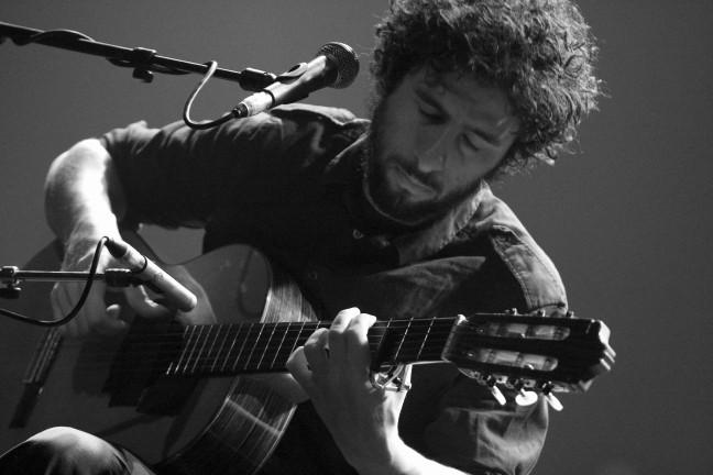 José González creating his signature guitar rhythms.