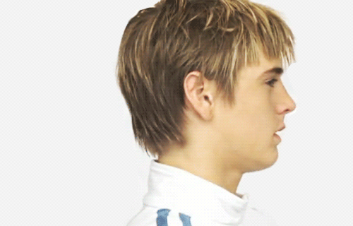 A younger Aaron Carter showing off his signature locks and pout