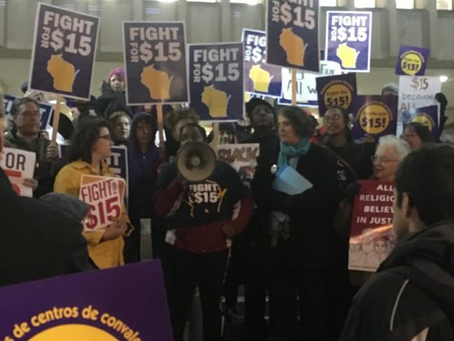 Fight for 15 minimum wage movement supporters rally outside City County Building