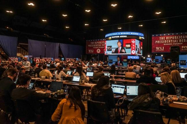  The debate was broadcast throughout the area via TV monitors and speakers. There were Jumbrotrons in the front of the room for all to see. When the debate was not being played on the screen, the room of more than 400 people fell nearly silent.  