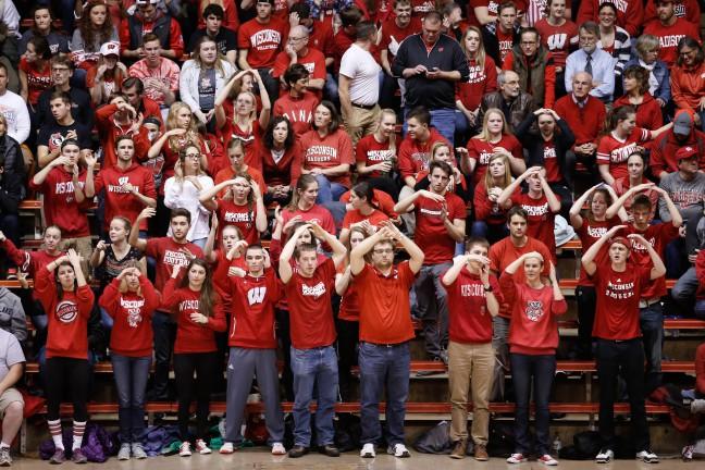 Upperclass students sit in the front row leading the student section cheer for their team. Wisconsin played against Oregon on Dec. 23, 2015 in the NCAA Division One Womens Volleyball Championship at Madison, WI.