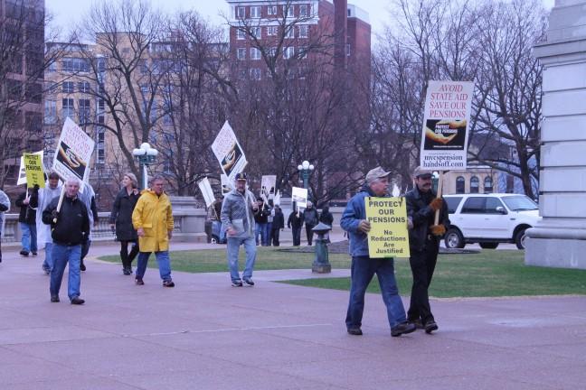 Retirees protest at the Capitol to fight pension cuts
