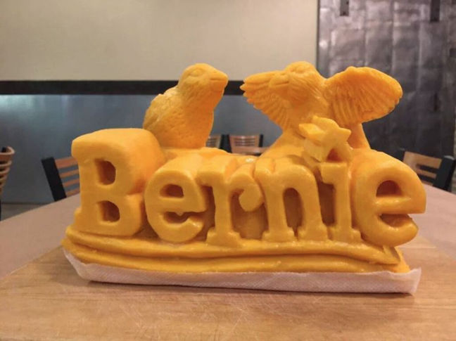 Look at the word Bernie carved out of a giant slab of cheese