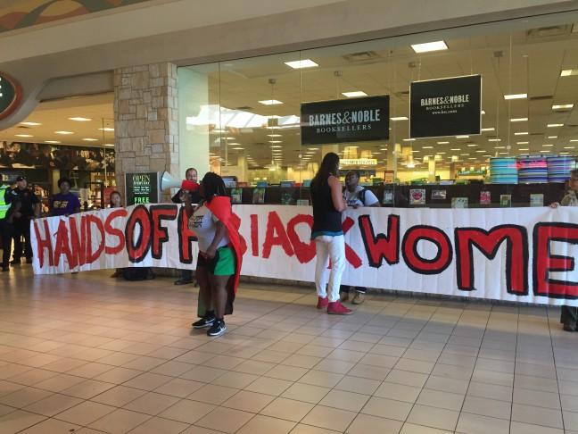 Community members gather at East Towne Mall to protest Genele Laird arrest
