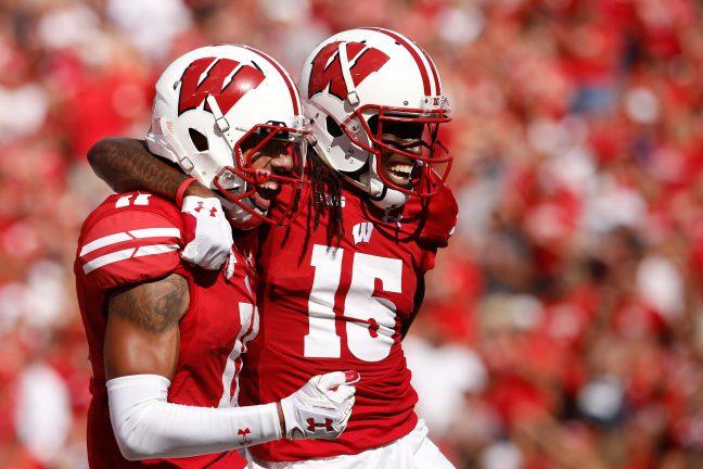 Jazz Peavy (11) and Robert Wheelwright (15) both had big days in the Badgers 54-10 win over Akron. 