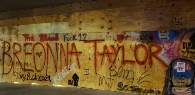 Breonna Taylor's name painted on a boarded window in the Veteran's Museum across from the Capitol.