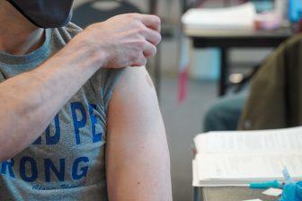 Badger Herald archival photo of a student getting a vaccine at the Nicholas Recreation Center vaccination site. April 22, 2021. 