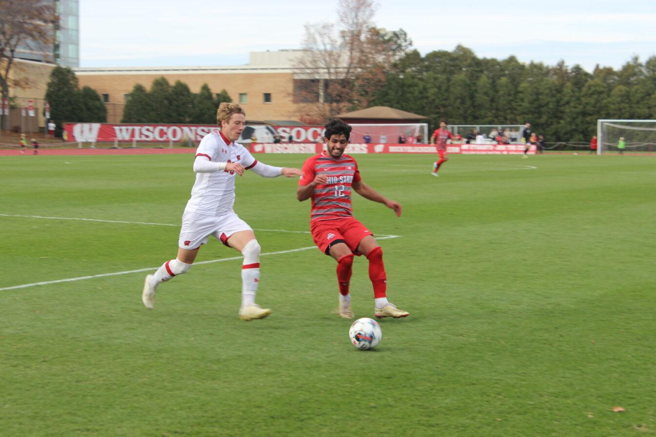 Badgers forward Mitchell Dryden attacks the ball against Ohio State.