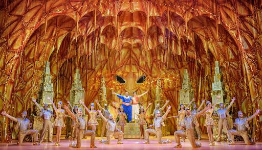 Aladdin, Genie and dancers pictured in Disneys Aladdin