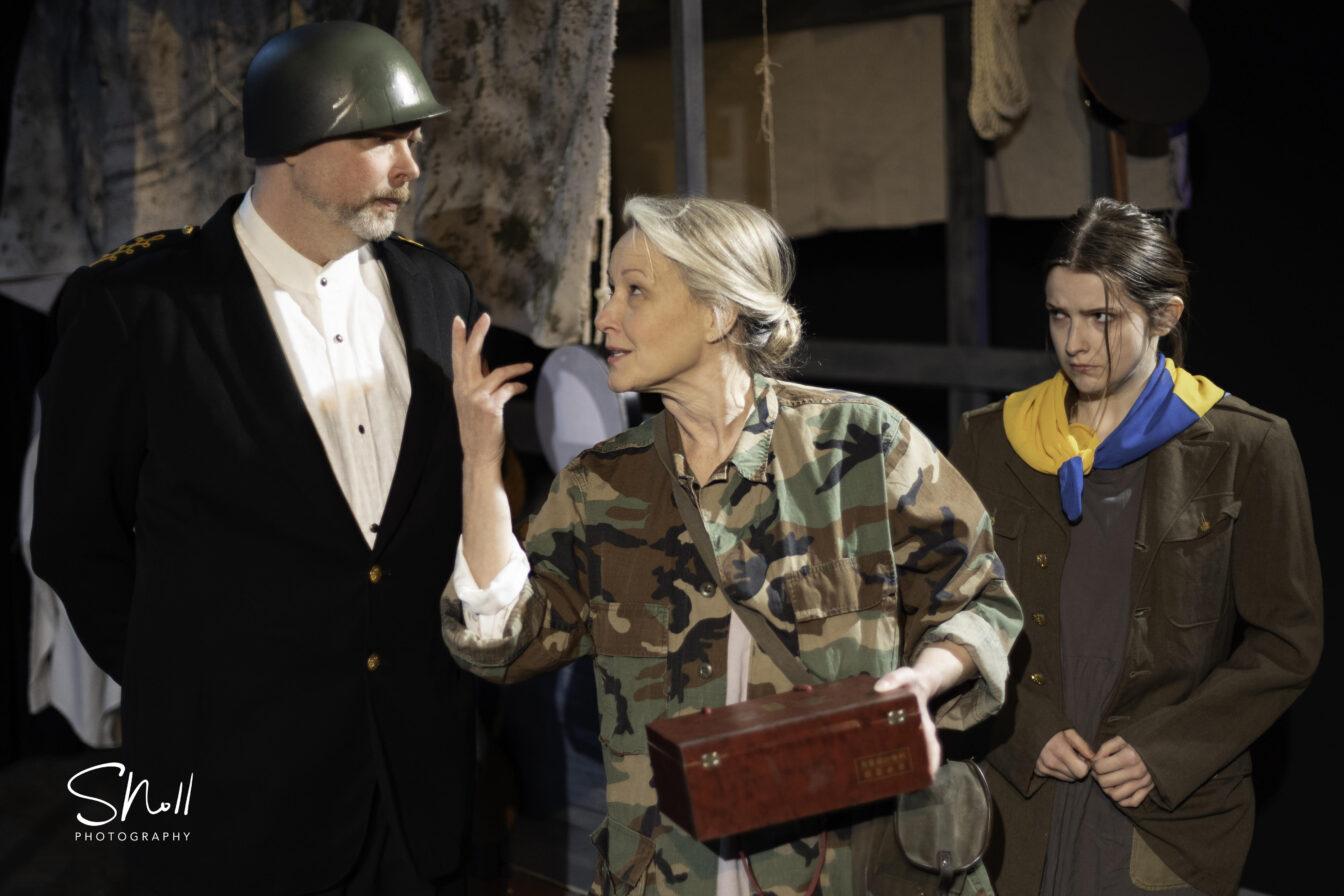 Matt Korda as the Sergeant, Stephanie Monday as Mother Courage, and Abigail Hindle as Kattrin