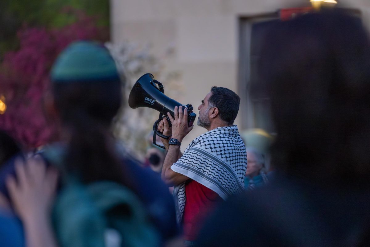 A demonstrator performs a call prayer at a liberation Shabbat at the Library Mall encampment on May 3, 2024.