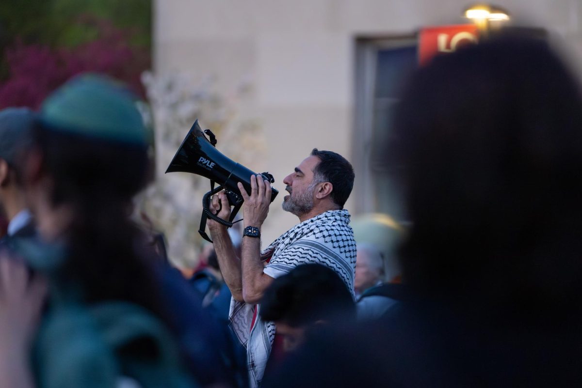 A demonstrator performs a call prayer at a liberation Shabbat at the Library Mall encampment. May 3, 2024.