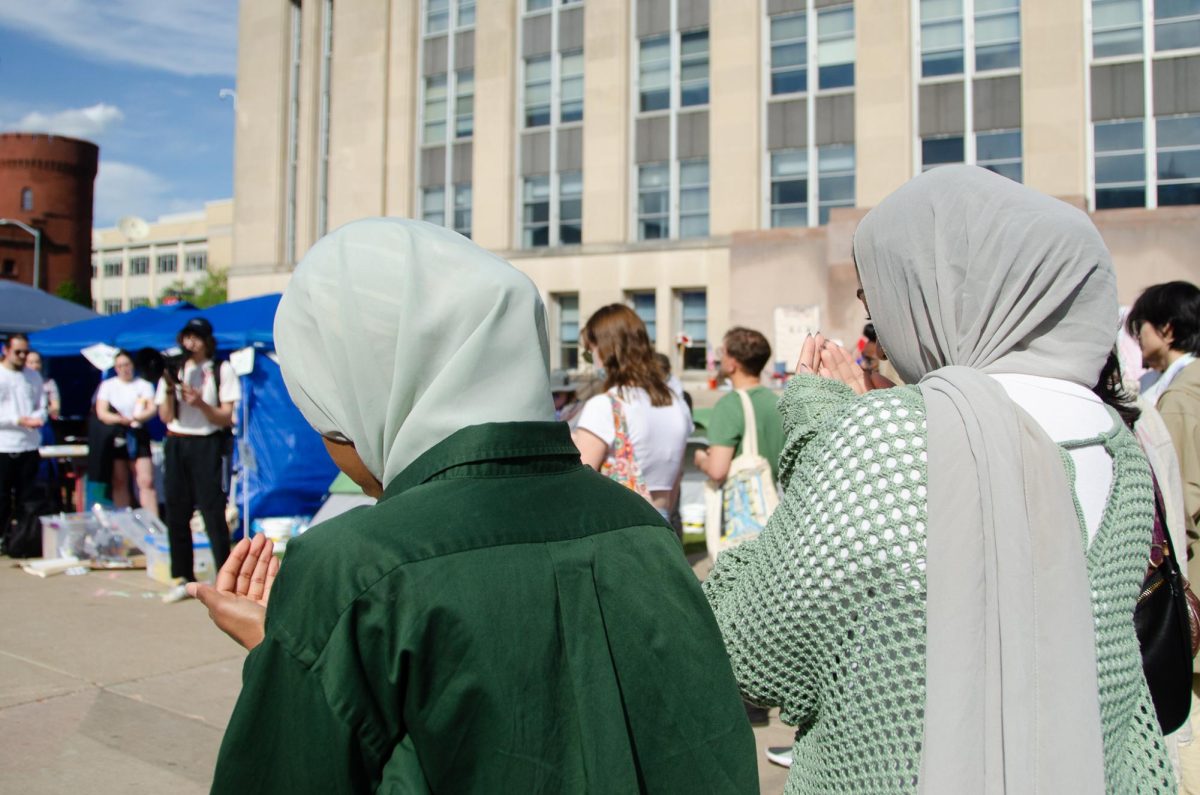 Demonstrators participate in a Muslim prayer for Gaza at the Library Mall encampment on May 8, 2024.