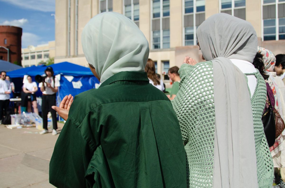 Demonstrators participate in a Muslim prayer for Gaza at the Library Mall encampment on May 8, 2024.