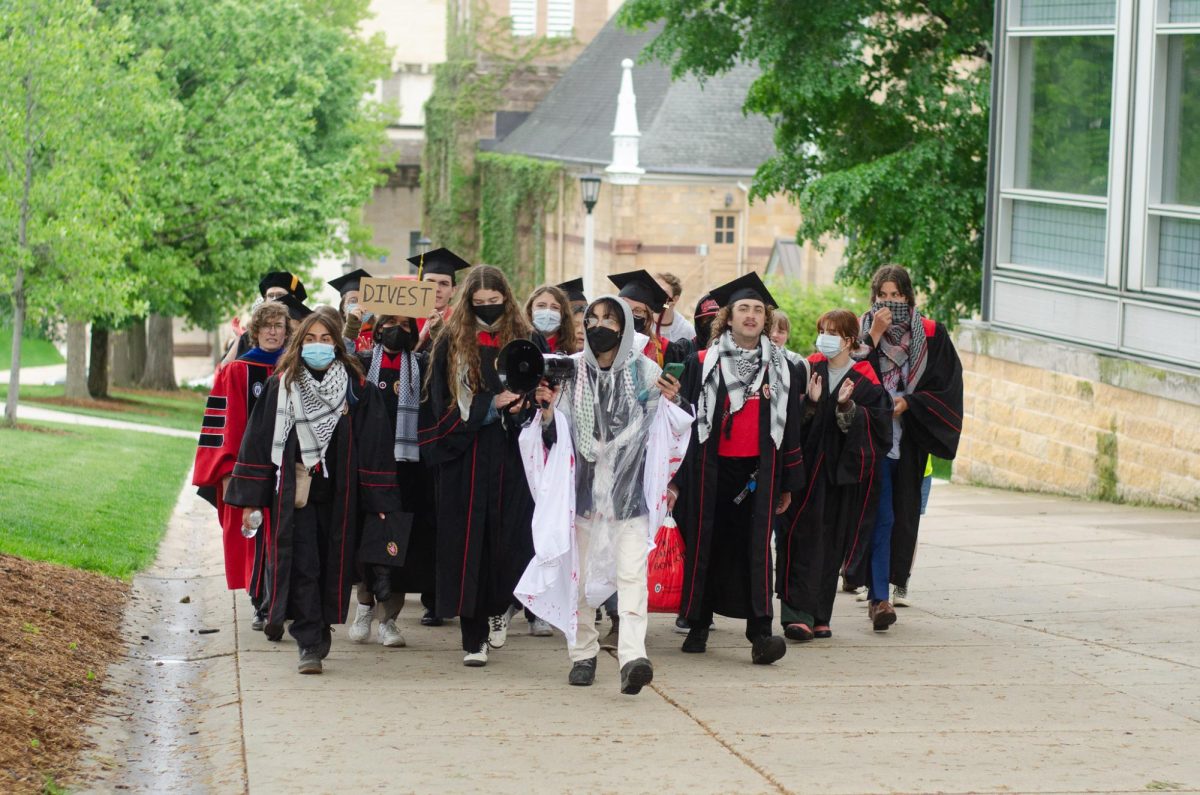 Protesters march up Bascom Hill ahead of die-in demonstration. May 9, 2024.