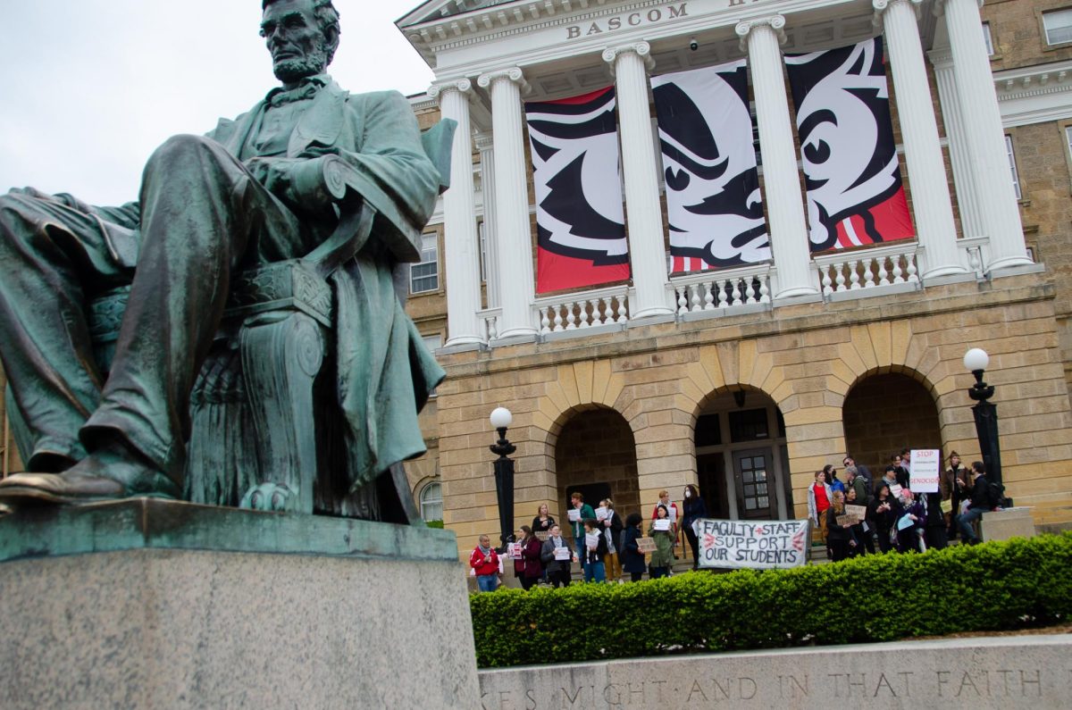 Faculty and staff of the University of Madison gather in front of Bascom Hall to show support for student demonstrators on May 2, 2024. 
