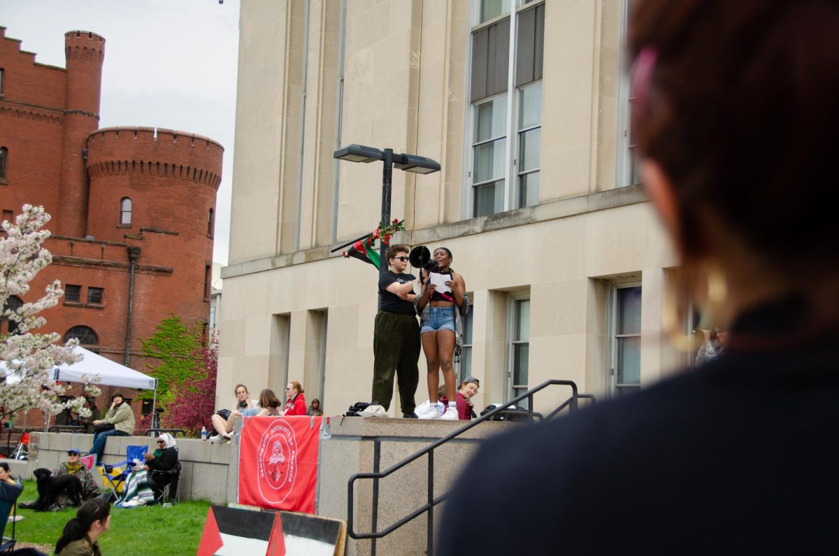 Anastasia Walker, a Madison West student, leads chants with the crowd at the Popular University for Gaza encampment at Library Mall on May 2, 2024. She, along with more than a dozen other students, participated in a walk out from Madison West in support of Gaza.