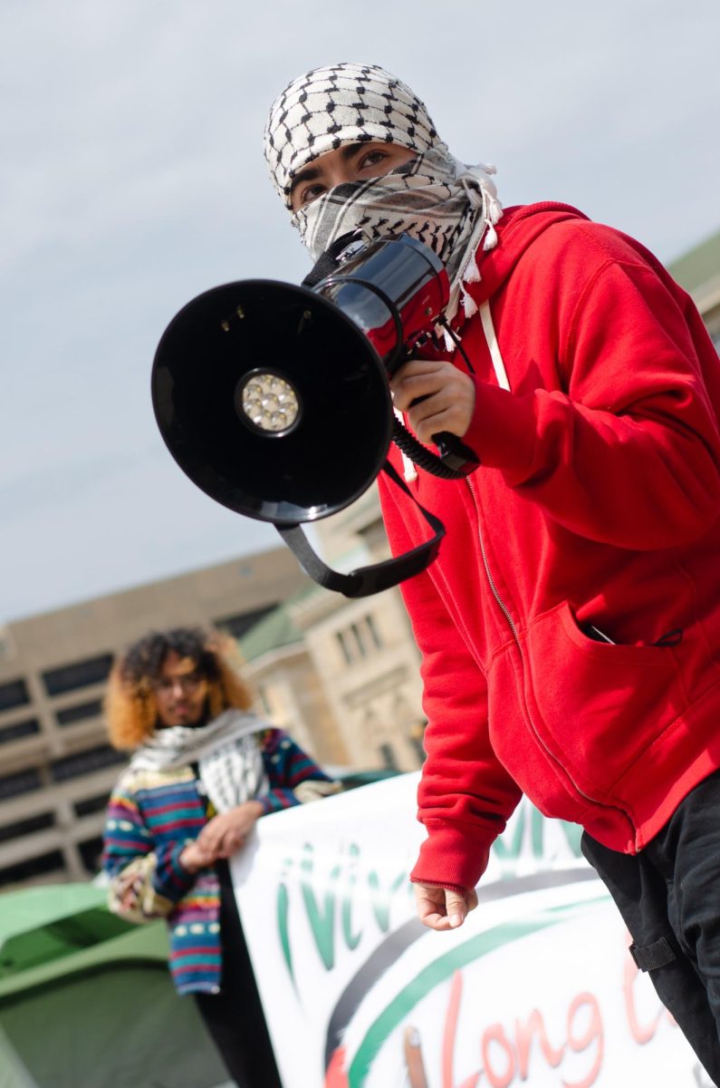 A demonstrator leads Pro-Palestinian chants at Library Mall on May 2, 2024. 