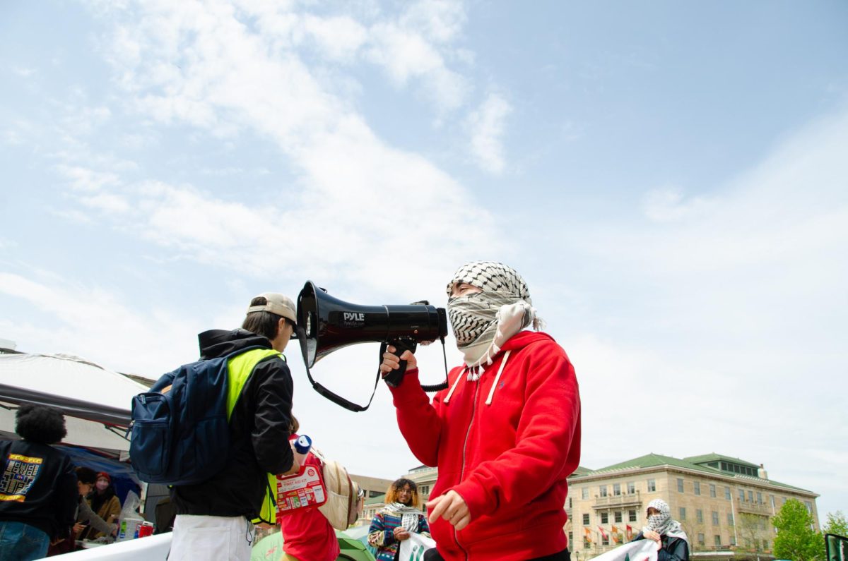 A demonstrator leads Pro-Palestinian chants at Library Mall on May 2, 2024. 