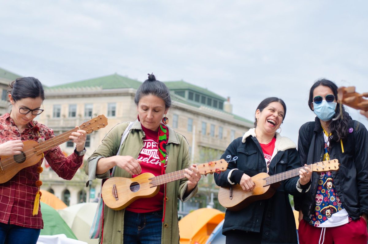 A group of six musicians play latin music in support of Palestine at Library Mall on May 2, 2024. 