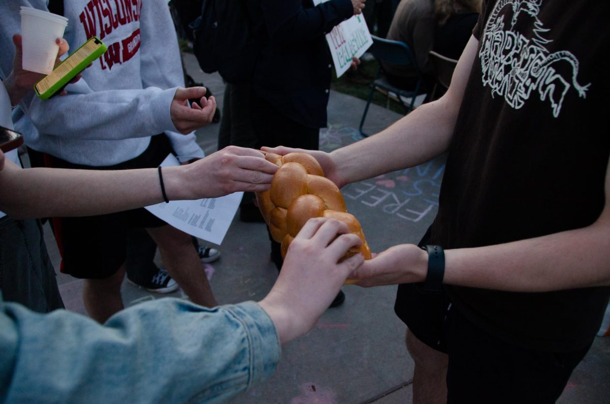 Demonstrators share bread at the Jews for Palestine Liberation Camp on May 3, 2024.
