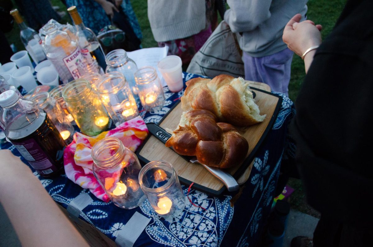 A table is set out with bread and grape juice at the Jews for Palestine Liberation Shabbat at Library Mall on May 3, 2024.