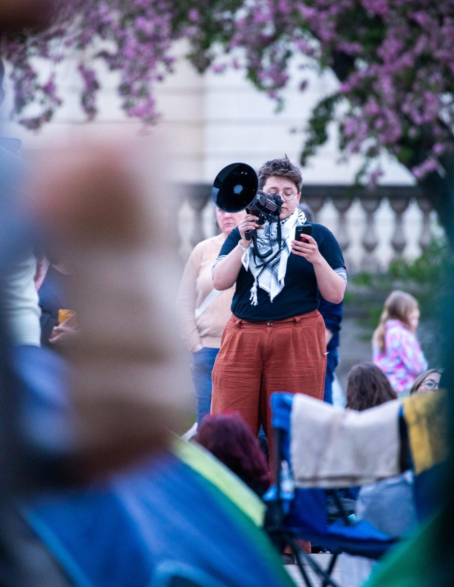 A protester addresses a crowd. April 30, 2024.