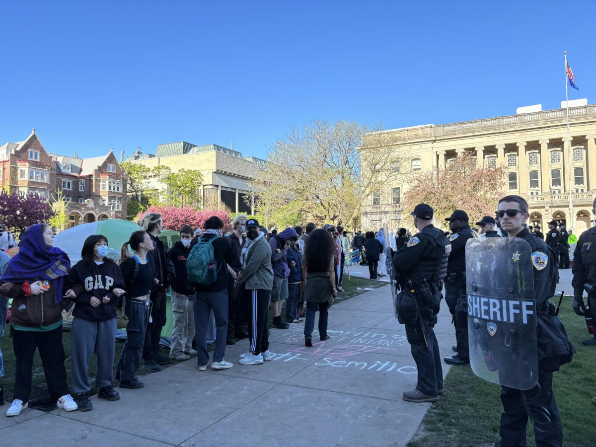 Police stand around the encampment on Library Mall. May 1, 2024.
