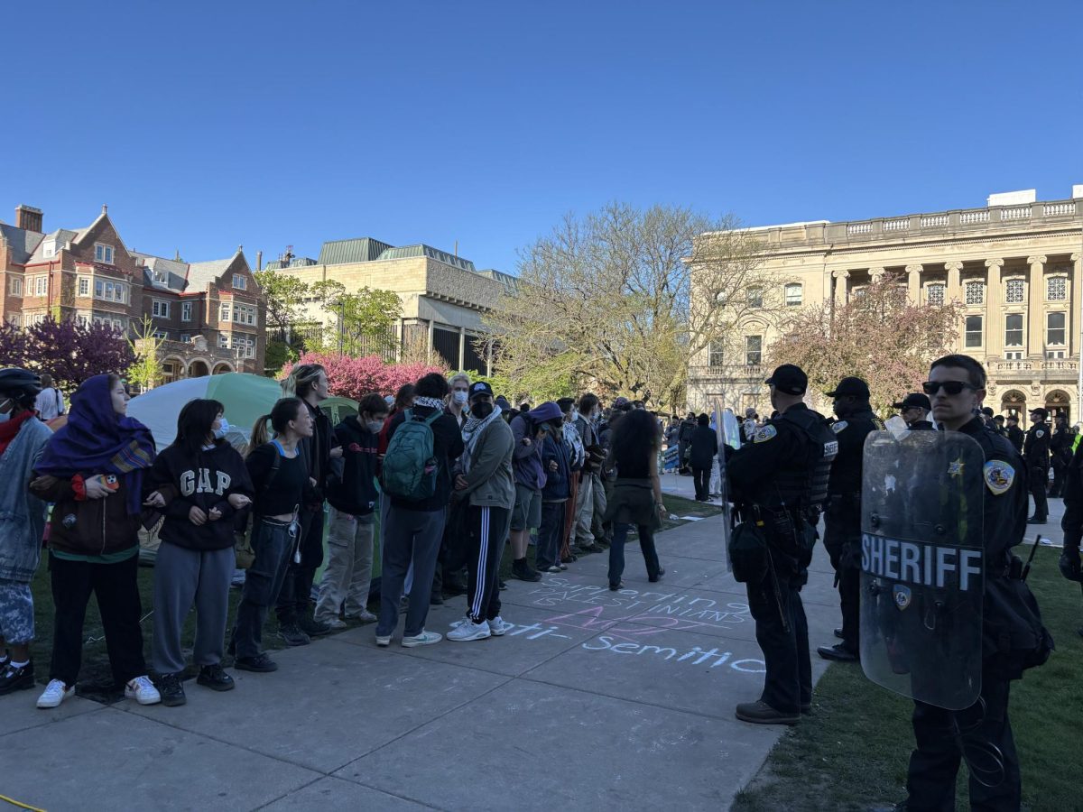 Police stand around the encampment on Library Mall. May 1, 2024.