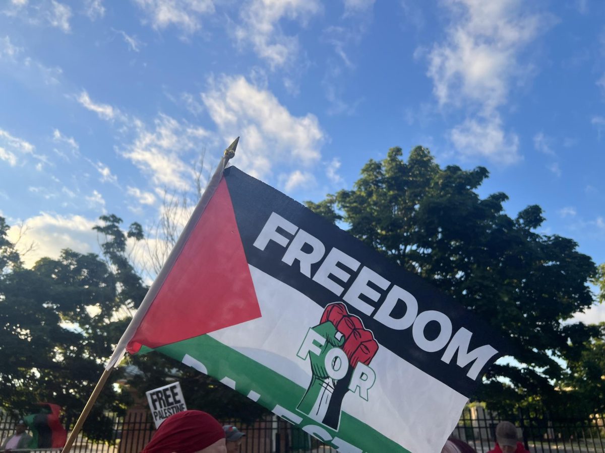 Signs held by pro-Palestinian protesters outside the Wisconsin State Democratic Convention in Milwaukee. June 8, 2024. 