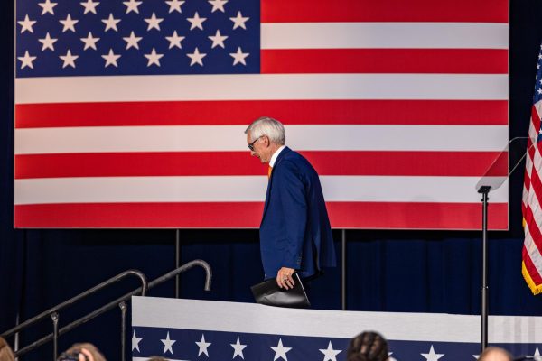 Governor Tony Evers departs the stage during Vice President Kamala Harris's campaign event in Milwaukee, Wisconsin. July 23, 2024.
