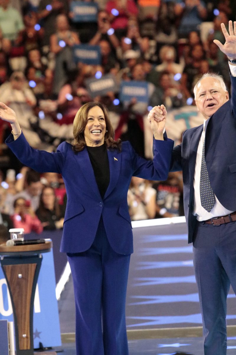 Harris and Walz grab hands to signal their goodbyes right before they walk off stage. Aug 20. 2024. 