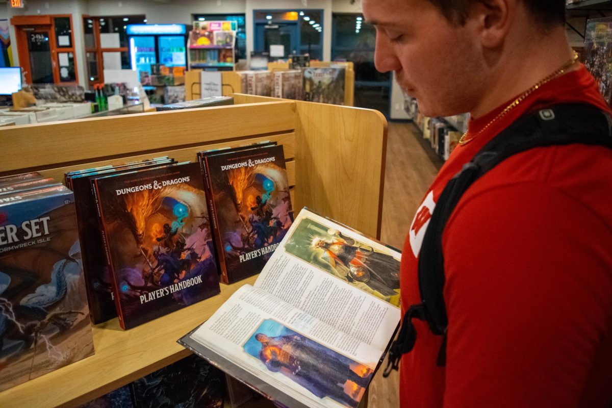 Local gamer inspects the re-released Dungeons and Dragons Player's Handbook fifty year anniversary edition. September 30, 2024.