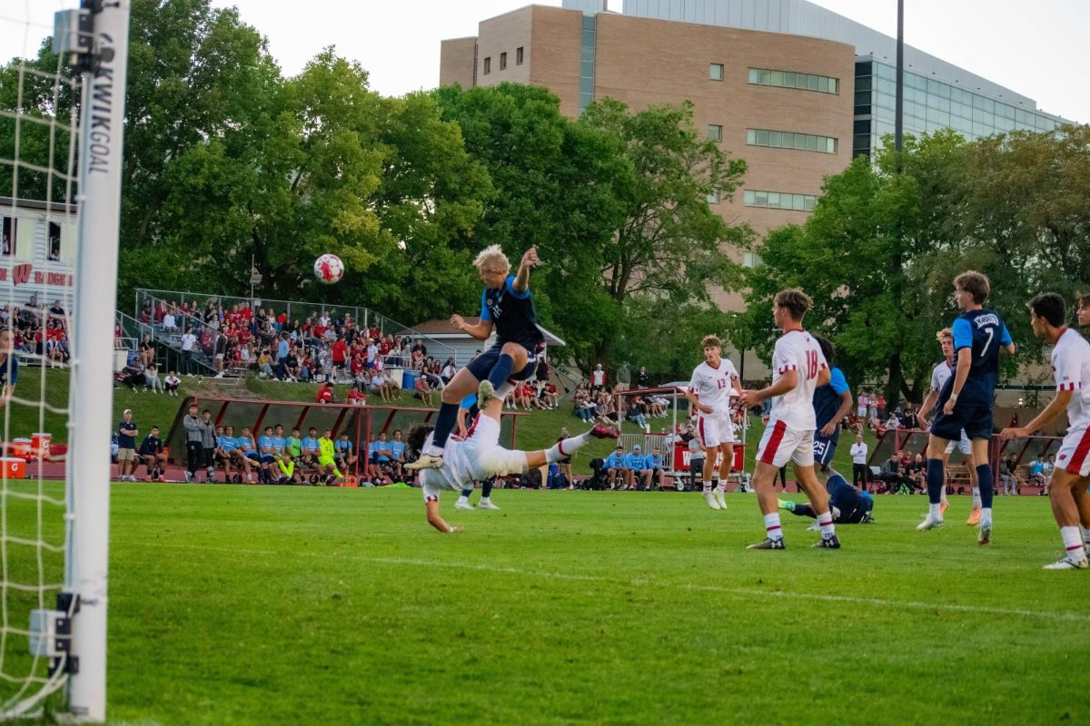 A collision in the Marquette penalty box.