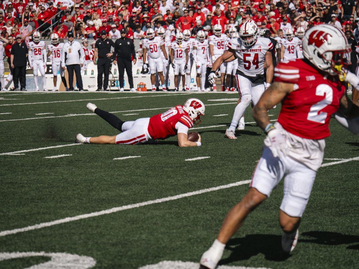 Quarterback Van Dyke falls down after losing traction. Sept. 7, 2024. 