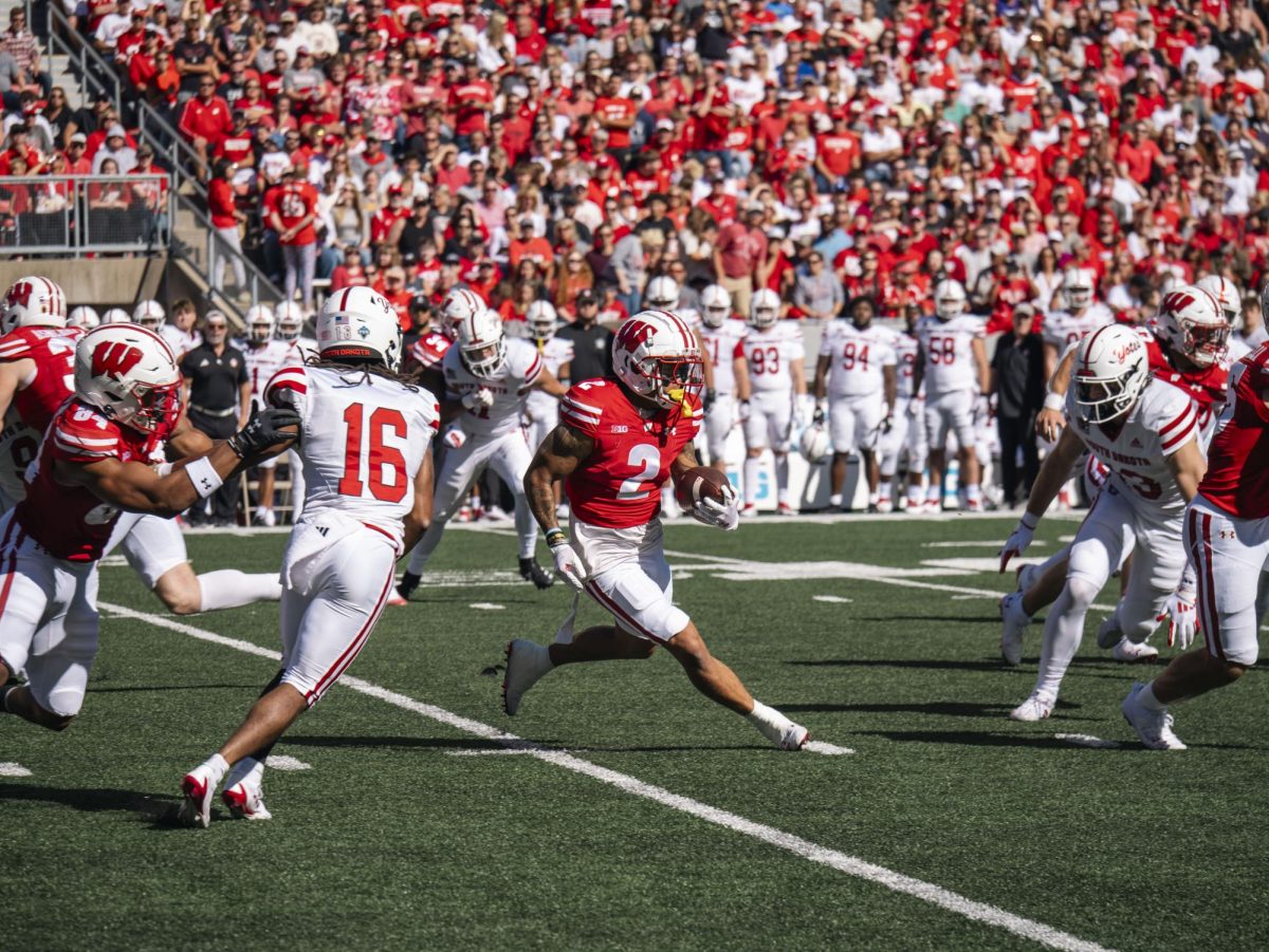 Badger Wider Receiver Trech Kekahuna evades South Dakota defenders on an 8 yard completion. Sept. 7, 2024. 