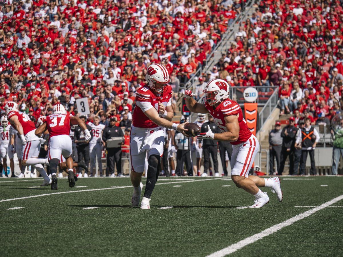 Badger Quarterback Tyler Van Dyke hands the ball of to Running Back Cade Yacamelli. Sept. 7, 2024. 