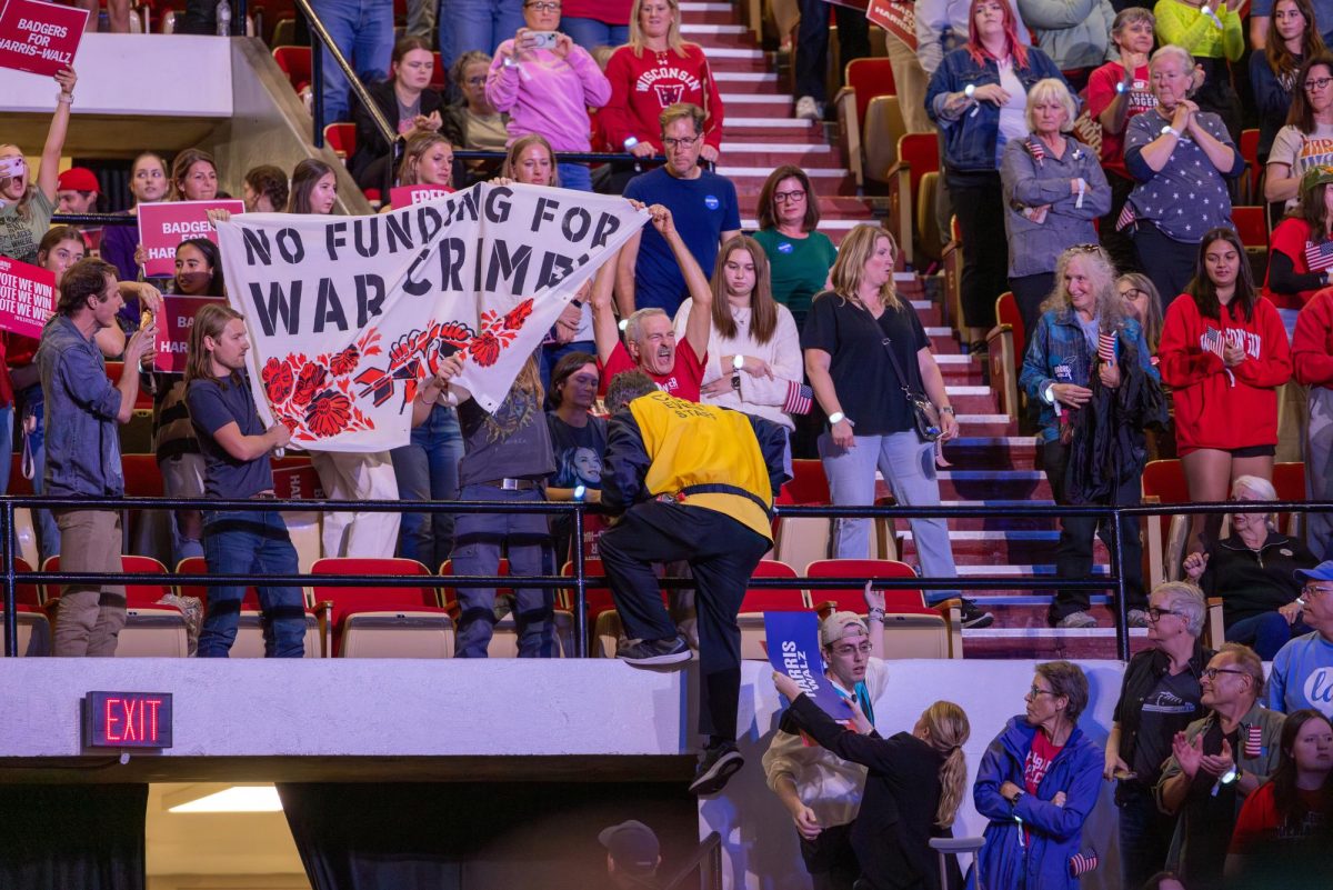 Event staffer scales balcony to confront pro-Palestine protesters. October 31, 2024. 