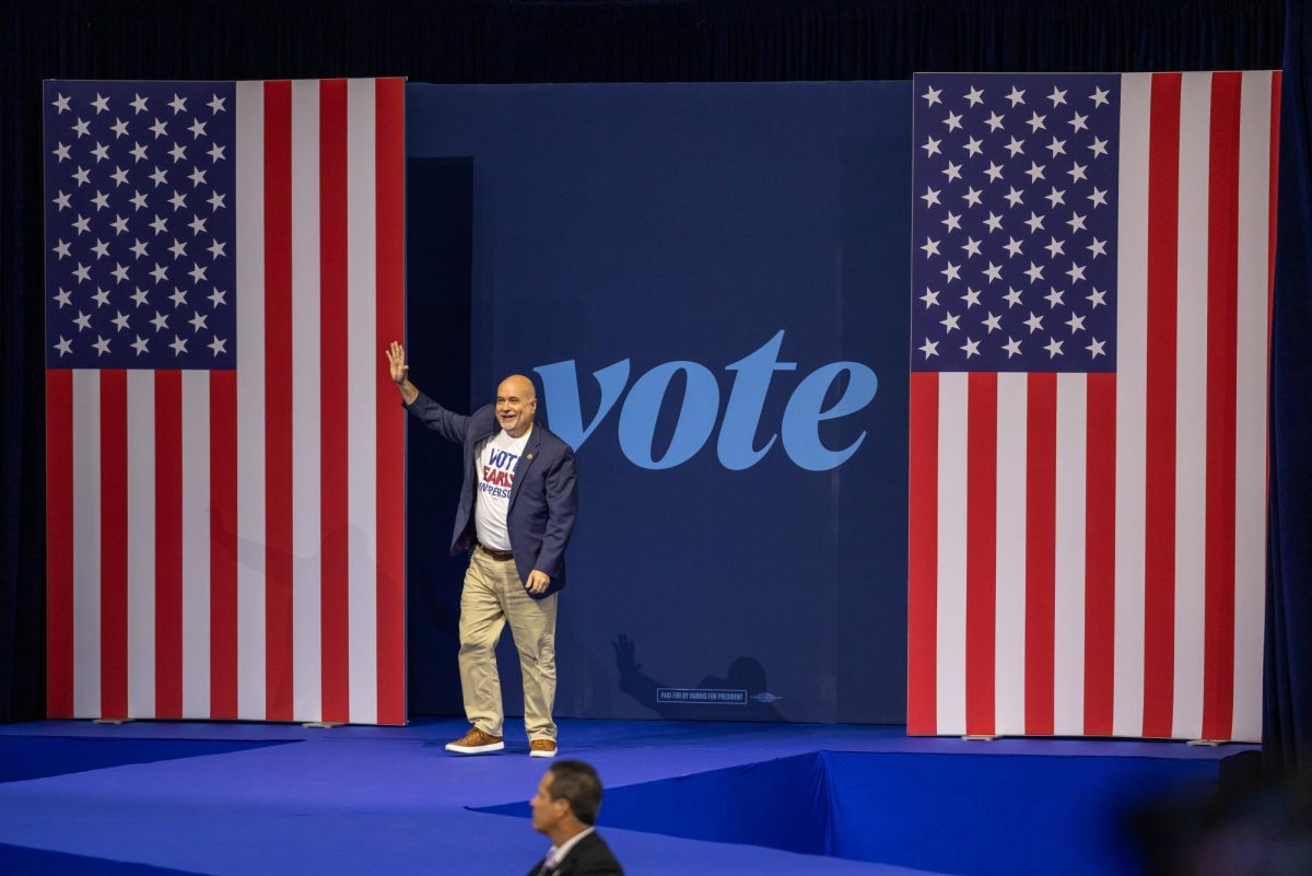 Congressman Mark Pocan walks on stage at a Harris Walz Campaign event. October 22, 2024