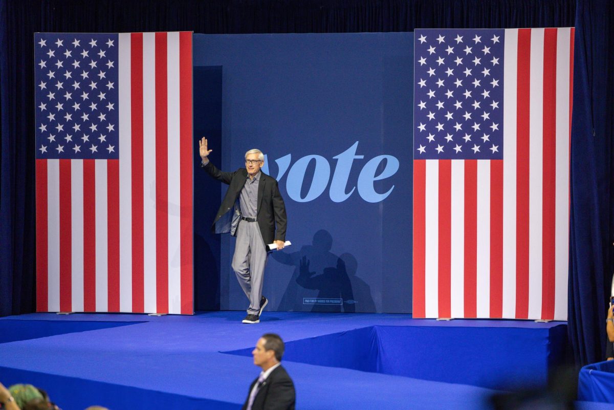 Governor Tony Evers walks on stage at a Harris Walz Campaign event. October 22, 2024