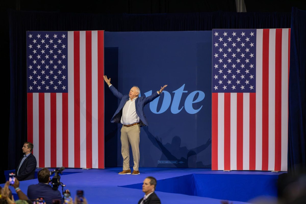 Vice Presidential Nominee and Minnesota Governor Tim Walz greets the audience at a Harris Walz Campaign event. October 22, 2024