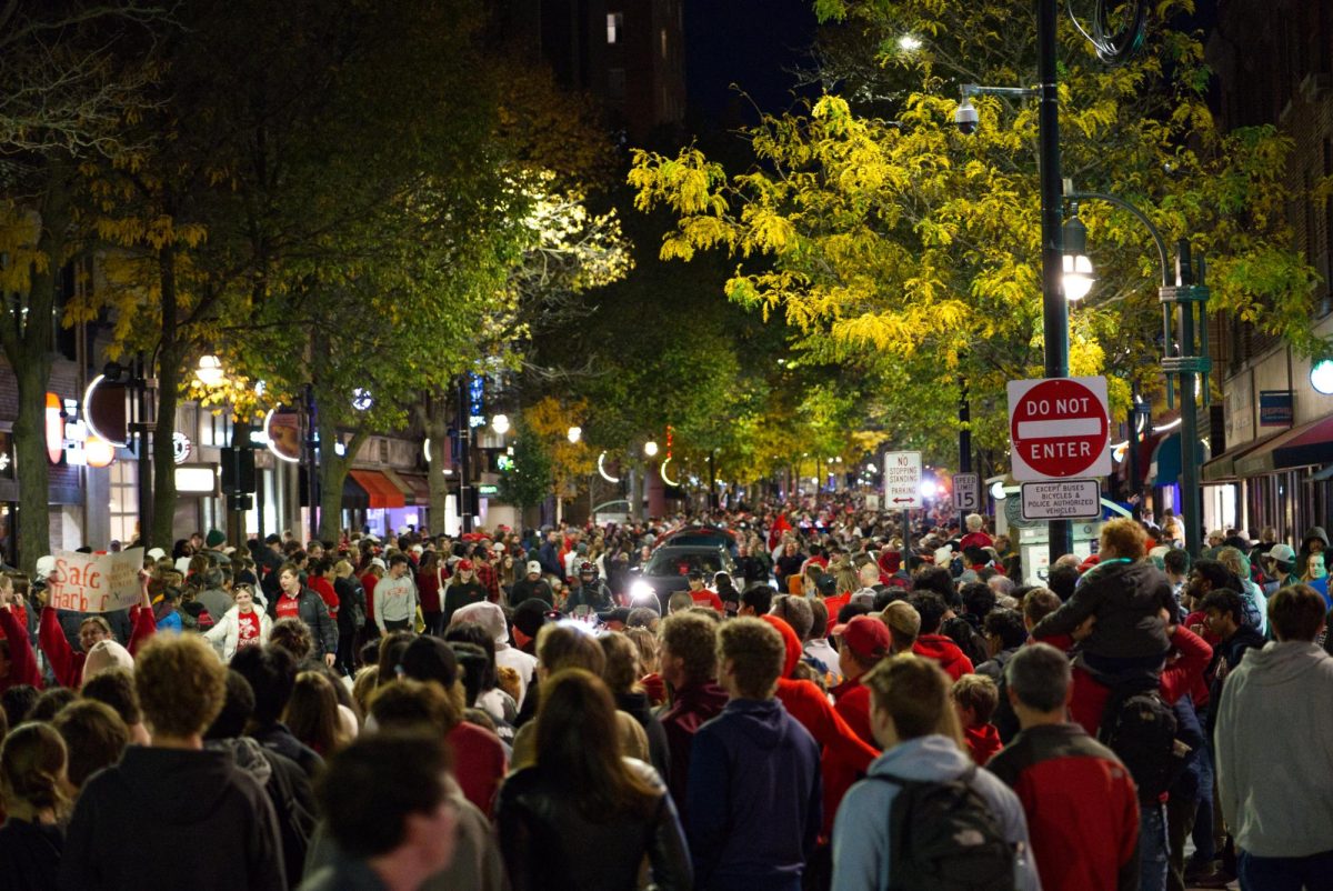 Onlookers crowd State Street to watch the UW Homecoming parade. October 25, 2024