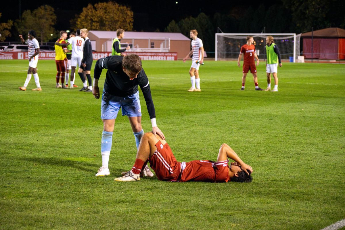 Ryan Quintos lays in the grass post match. October 19, 2024.